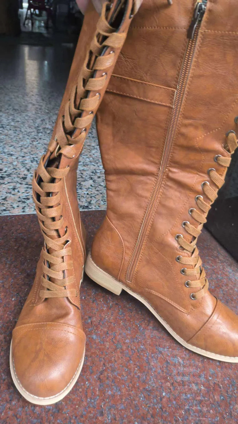 Women's cross strap knight boots in solid colour artificial PU, available in red black brown sizes 36-43
