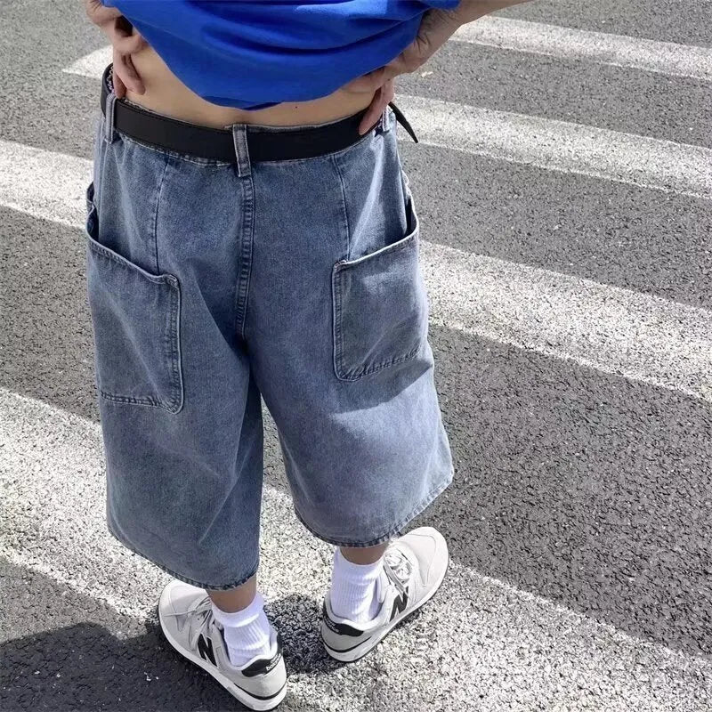 Man's washed light blue denim shorts with a high waist, cropped length, and straight legs.