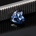 A colourful heart-shaped moissanite gemstone in various sizes and shades including lemon yellow, pink and sapphire blue.