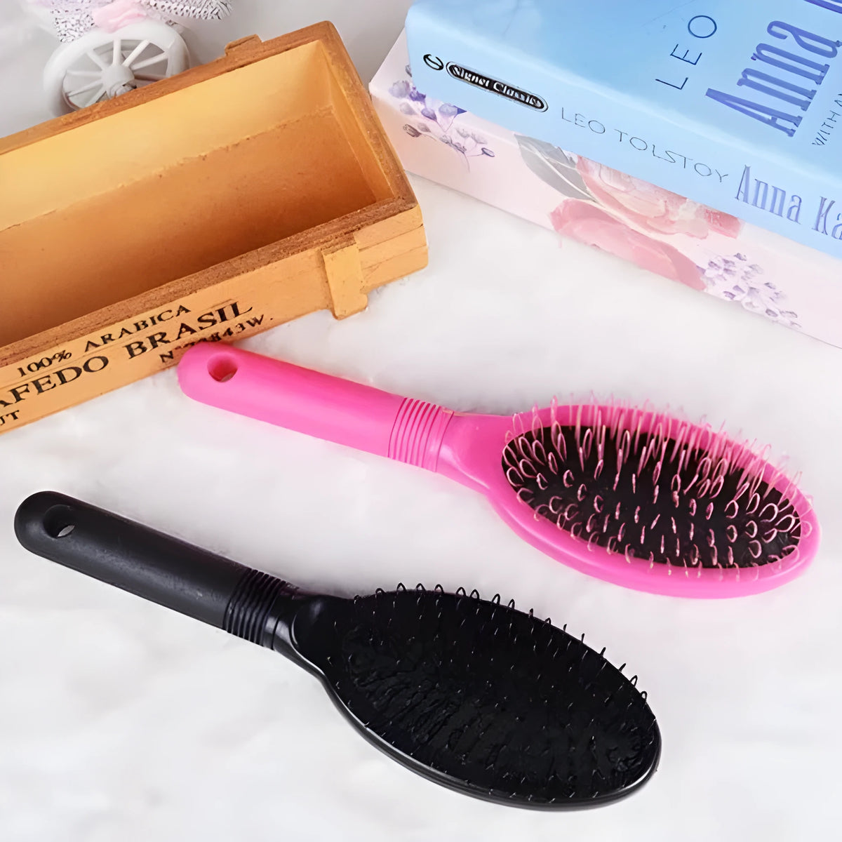 Black and pink ring tooth hair extension comb with airbag cushioning, 22cm length