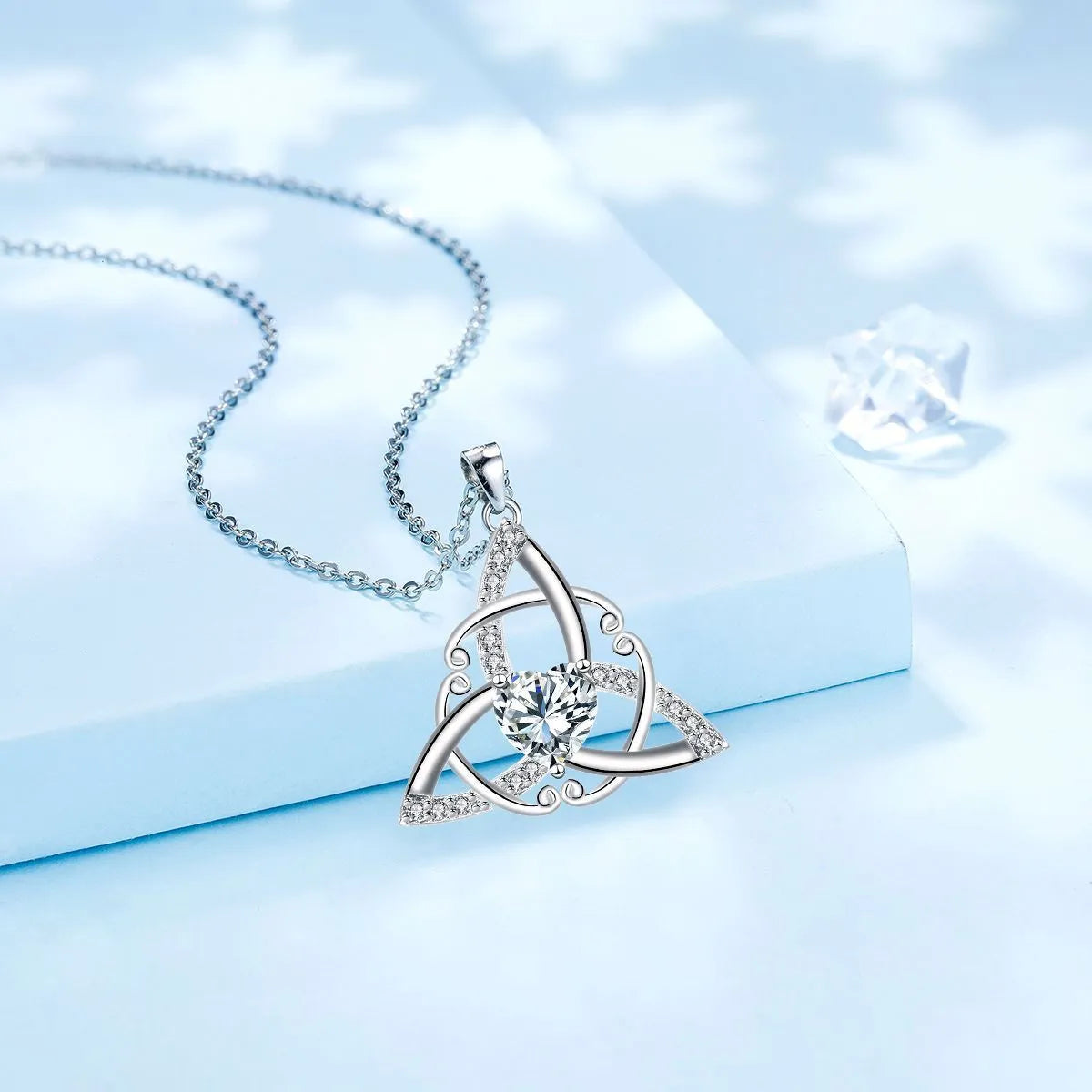 Geometric Celtic knot pendant necklace for women in copper with a choice of coloured electroplated finishes.