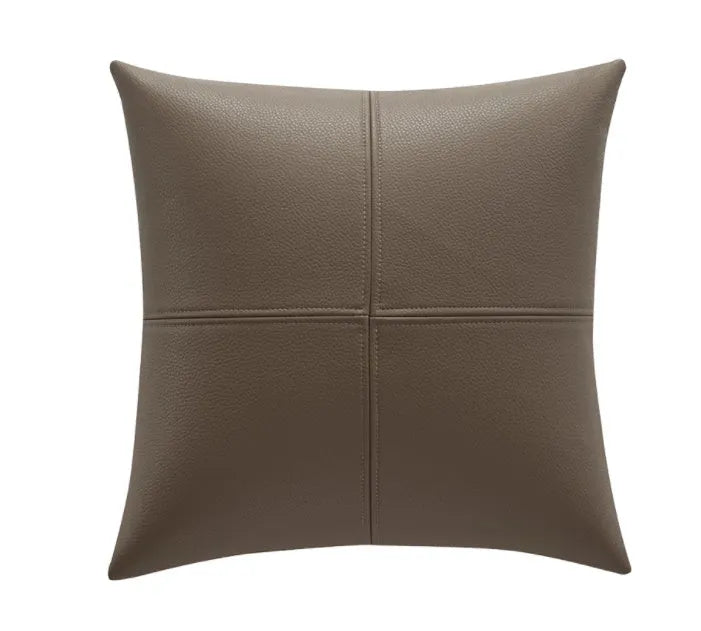 Solid colour cowhide leather pillow cover in Nordic style on a grey sofa.