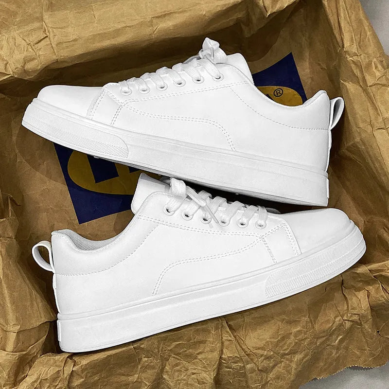 Men's low-top Korean-style sneakers in all black, all white, and black with white bottom colours on a rubber sole