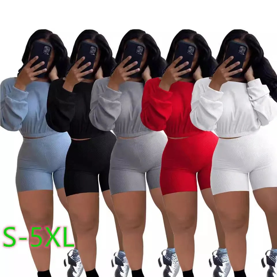 Women's solid colour off-the-shoulder long sleeve top and matching shorts two-piece set.
