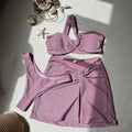 Women's one-shoulder tube top swimsuit three-piece set in glossy polyester fabric.