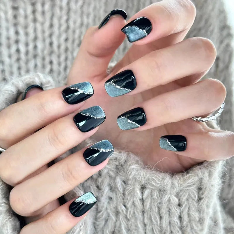 Five sets of short square shaped press-on fake nails with a peel-and-stick backing, shown in assorted colours.