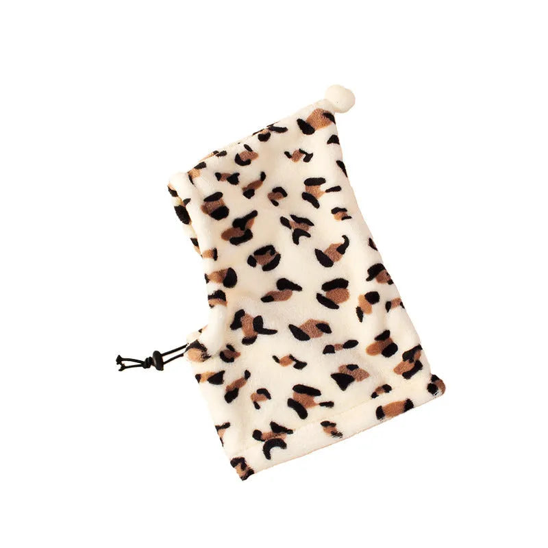 Pet wearing cloth headgear with combined bear and rabbit ears in leopard print colour