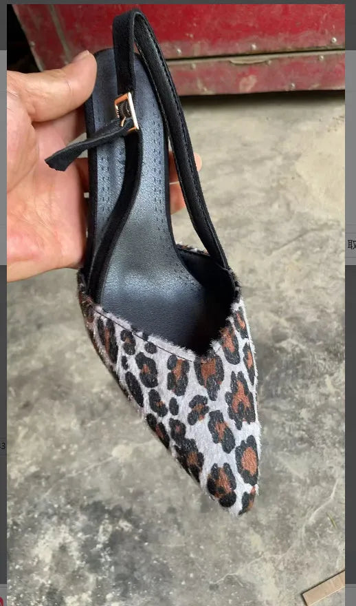 Leopard print suede women's sandals with a pointed toe and high heel.
