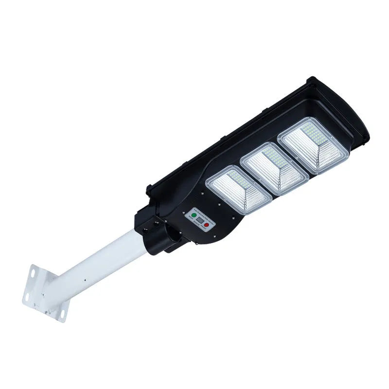 Integrated solar street light with solar panel and LED light in single housing unit for outdoor installation