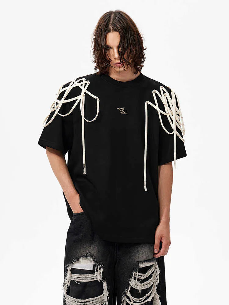 Black loose fit t-shirt with padded shoulders featuring rivet ribbon detail