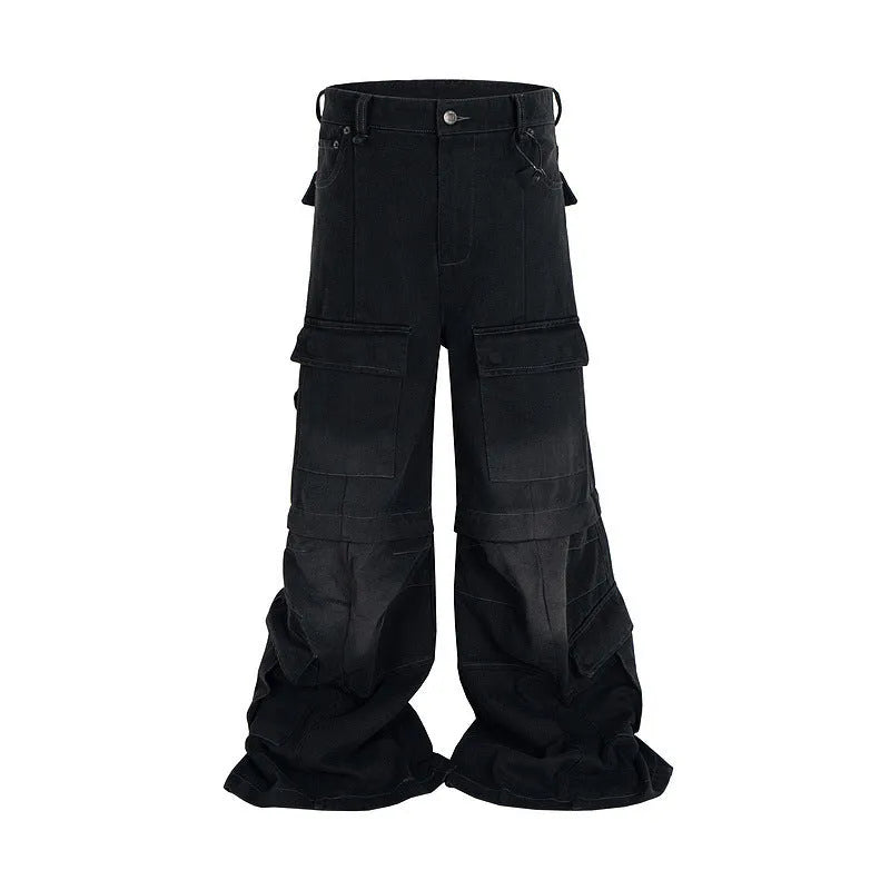 Black washed-out cotton overalls on a hanger, showing detachable pockets and a zip fly.