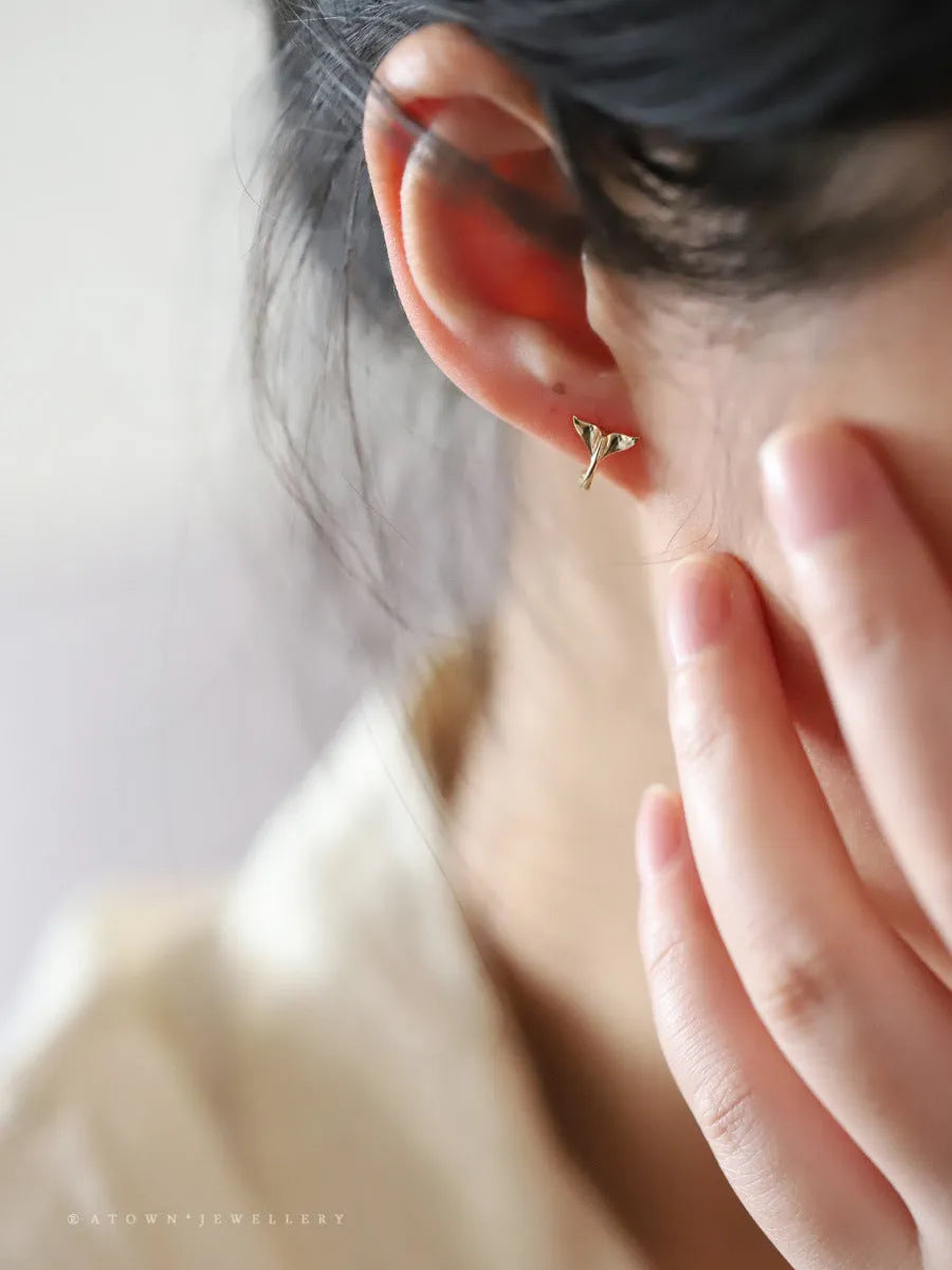 Pair of S925 sterling silver earrings with 14k gold plating featuring a smooth fishtail design and 8mm inner diameter