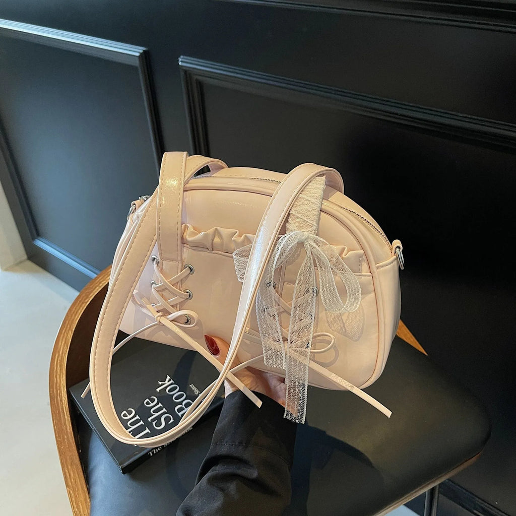 Ladies casual shoulder bag with bandage bow detail and internal mobile phone compartment