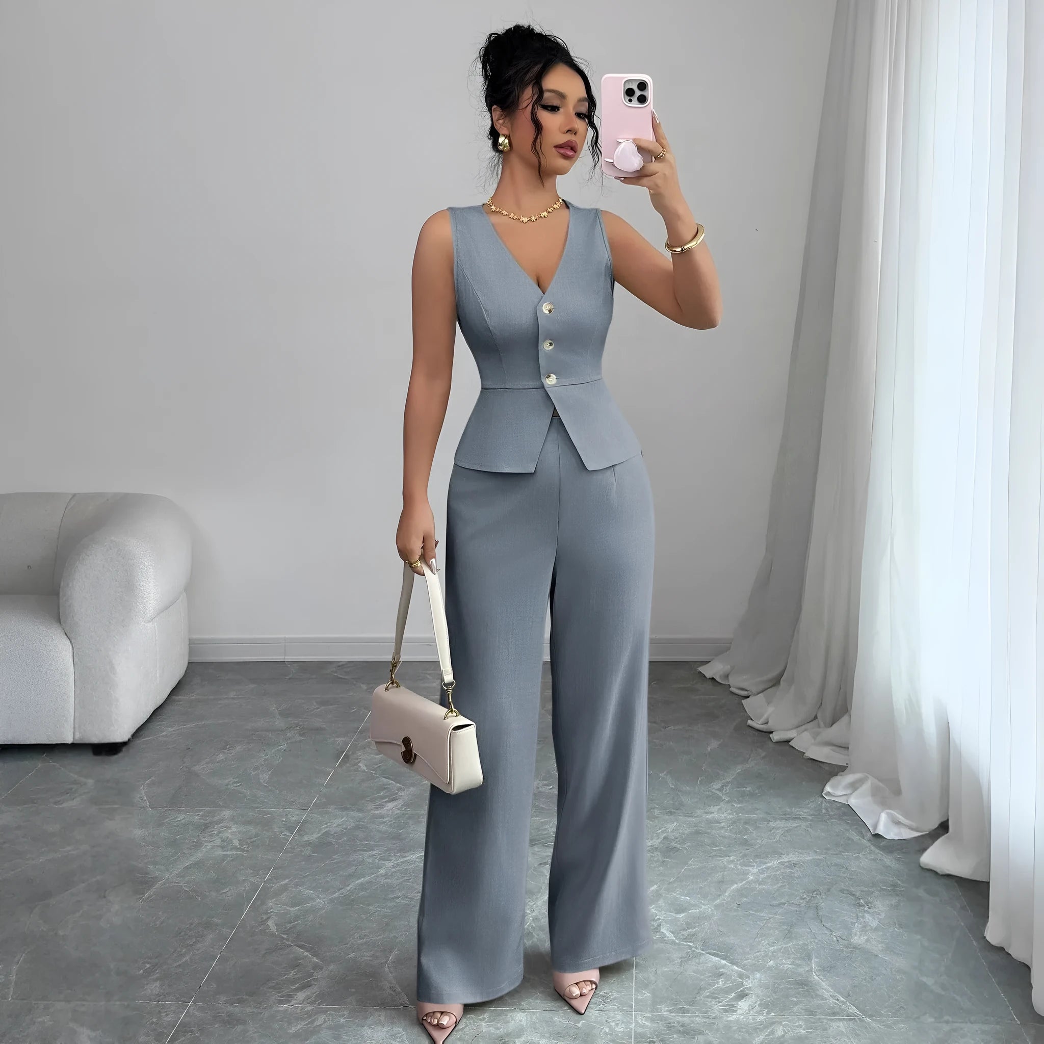 Women's solid colour sleeveless vest and high waist trousers two-piece set in a casual style.