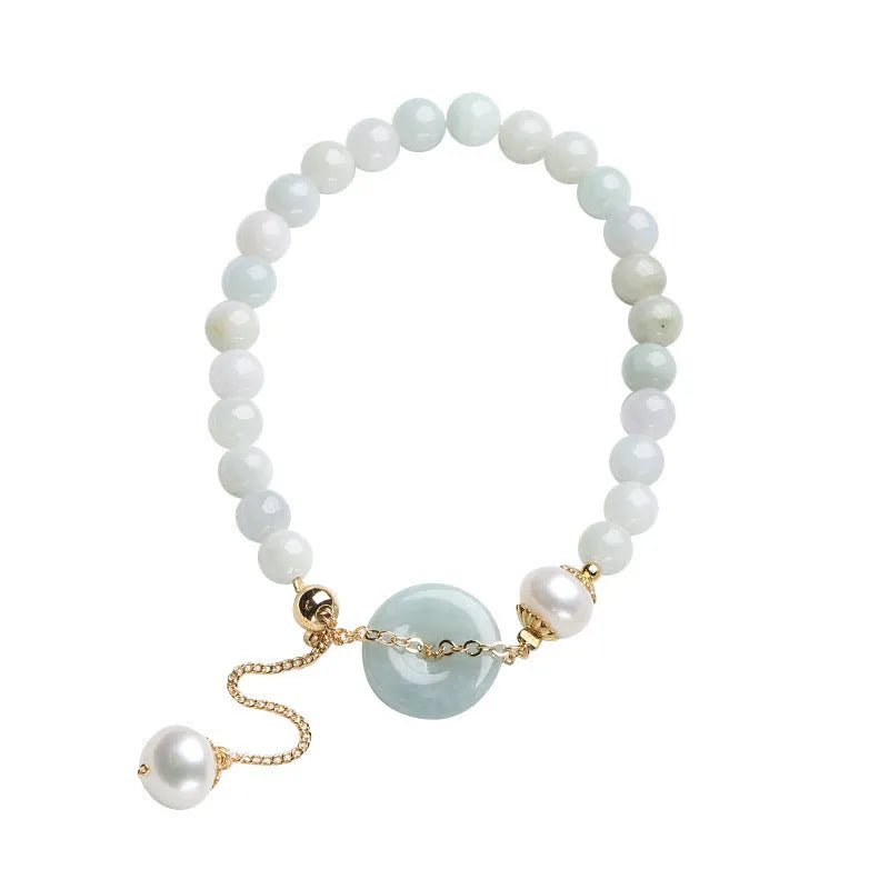 Women's natural emerald peace buckle pearl bracelet with geometric jade pendant on wrist