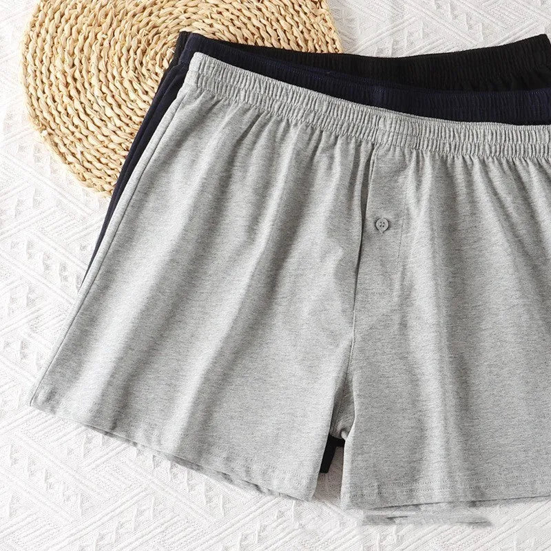 Men's pure cotton loose fit boxer shorts in solid black, light gray, and navy blue with high waist design