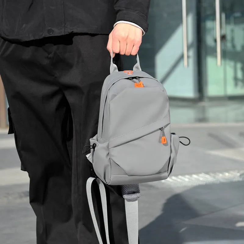 Men's black casual crossbody bag with a single shoulder strap made from waterproof polyester.