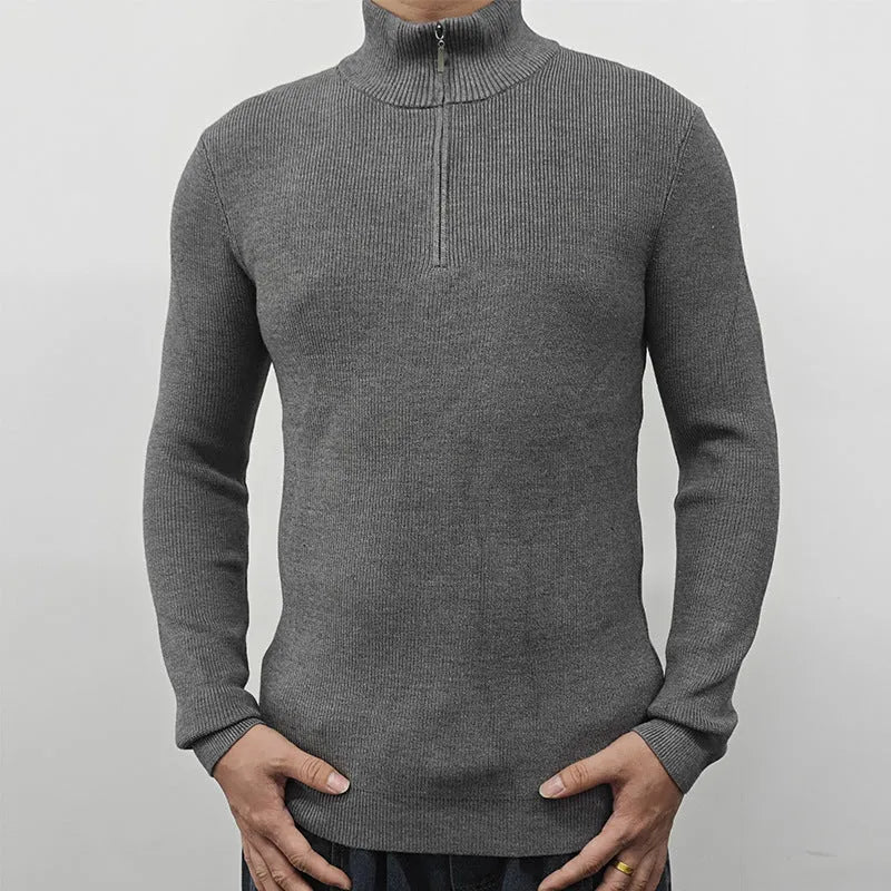 Man wearing a green half-turtleneck zip-up sweater, a casual pullover for spring or autumn.