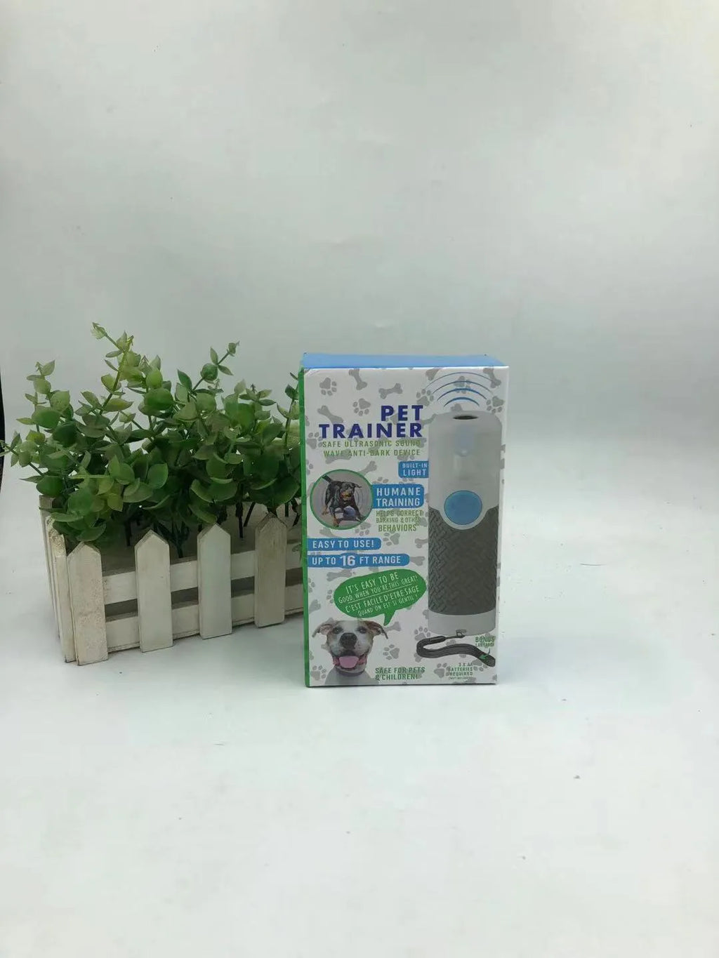 White ultrasonic handheld dog trainer for bark control with ABS plastic construction