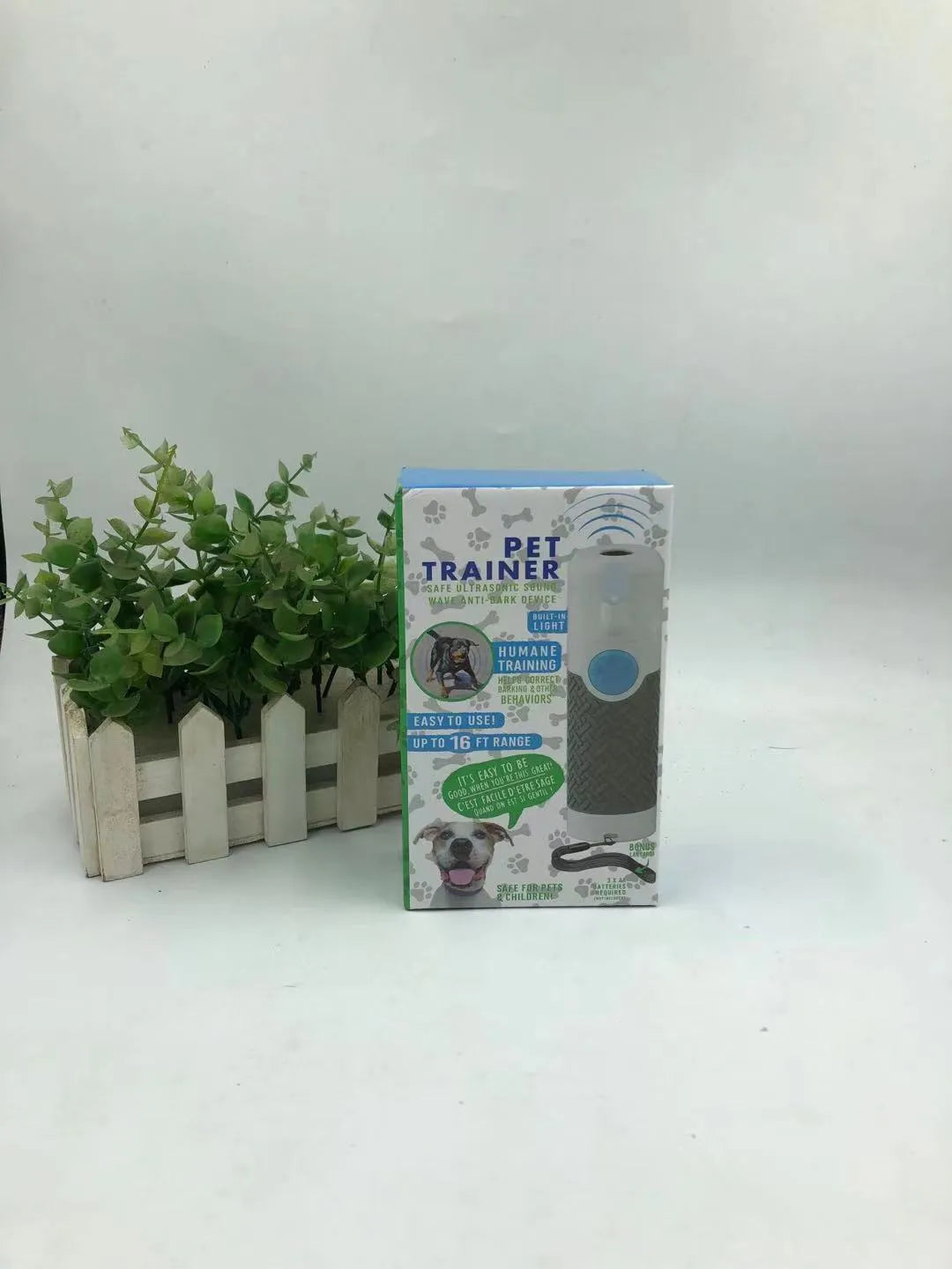 White ultrasonic handheld dog trainer for bark control with ABS plastic construction