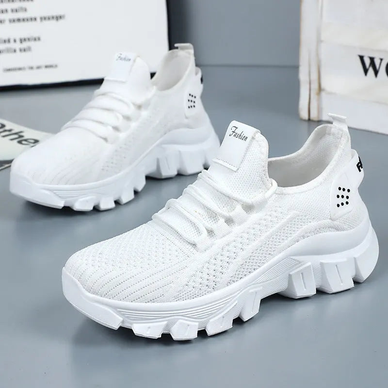 Women's white sneaker with thick PVC sole and breathable flyknit upper