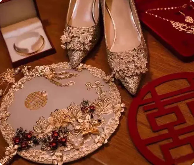 Champagne coloured women's wedding high heel shoes with crystal decoration and a pointed toe.