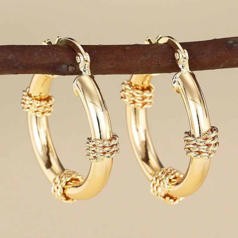 Geometric copper women's earrings with ring ear clip design in golden colour