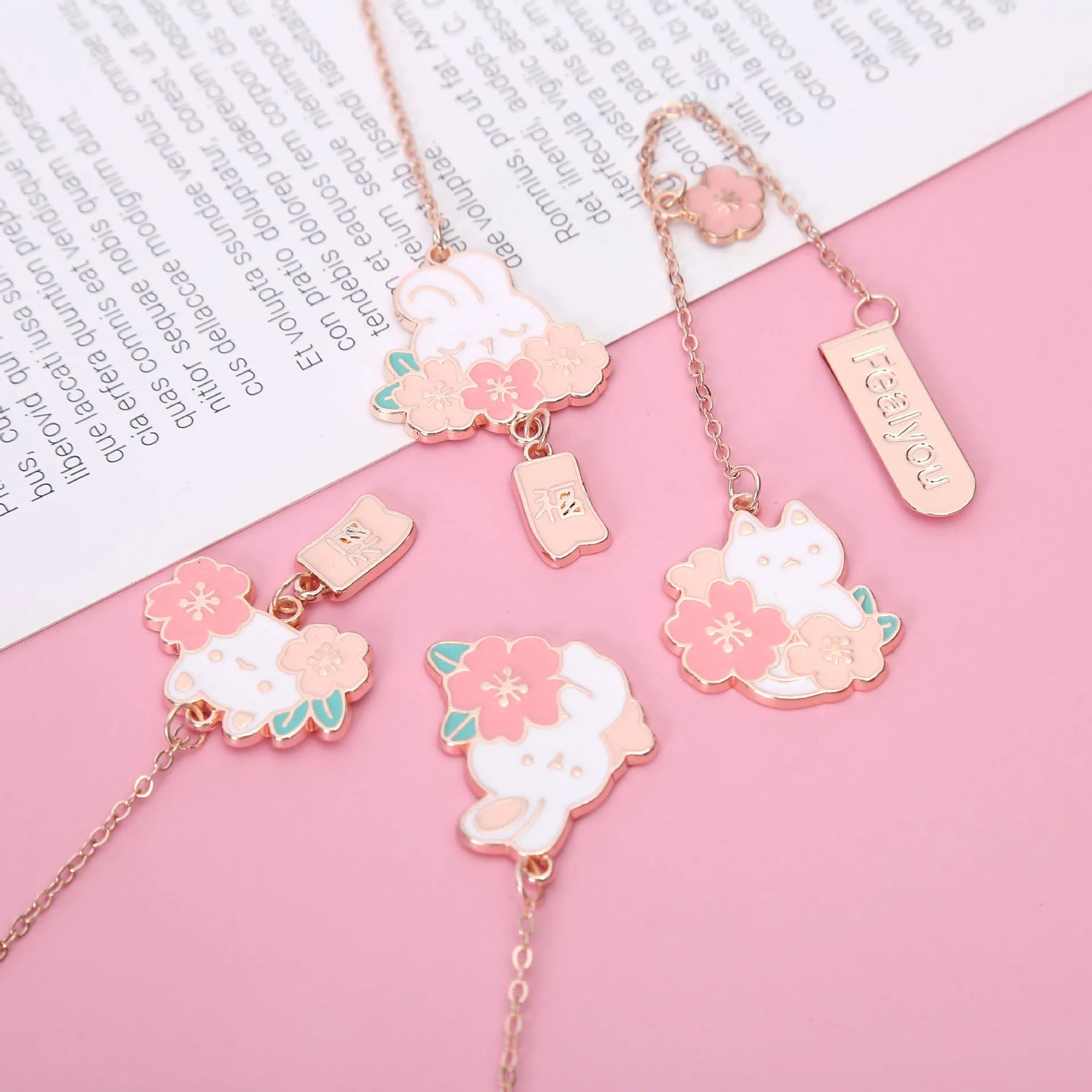 Metal book holder with cherry cat pendant decoration for journals and books