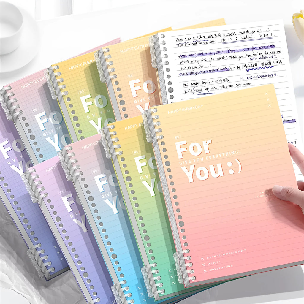 Removable coil gradient notebook in blue colour showing spiral binding and wood-free paper pages