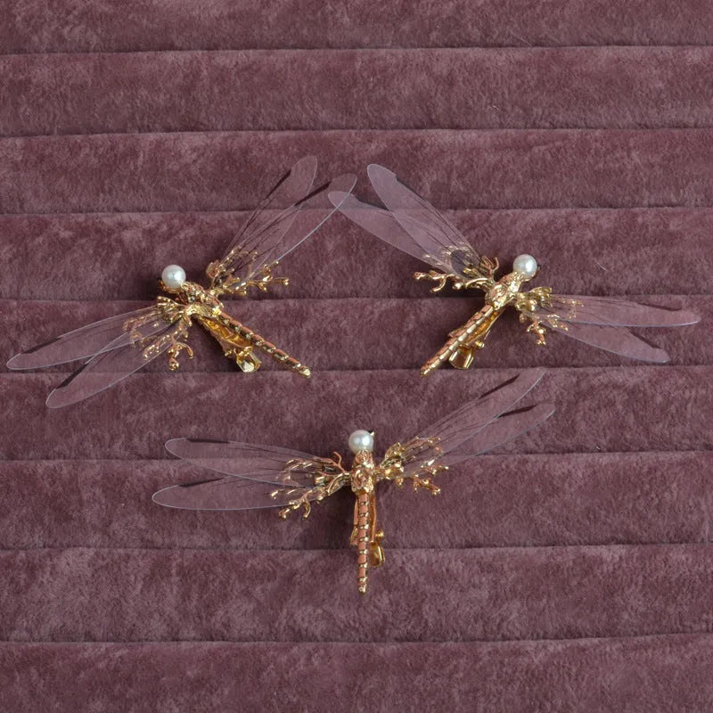 Golden electroplated alloy dragonfly side clip headdress for women.