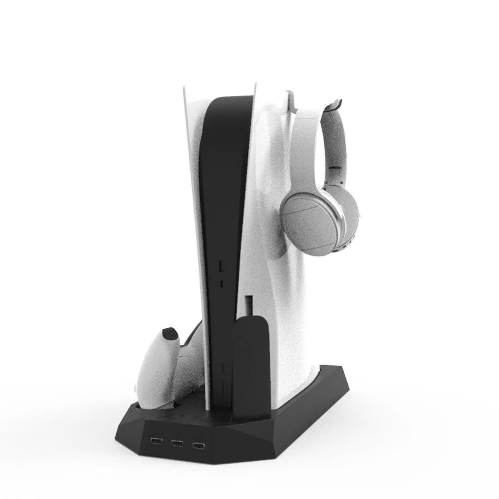 Black PS5 charging base stand holding a console upright with two wireless controllers charging in slots.