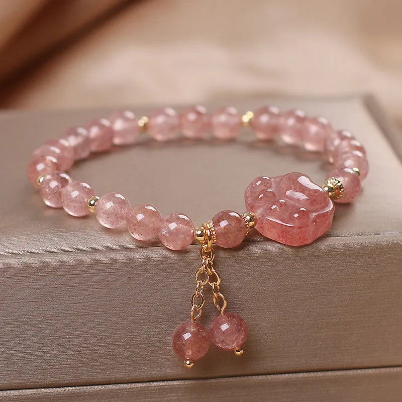 Women's double layer crystal bracelet with lucky cat charm and red cat's eye flower beads.