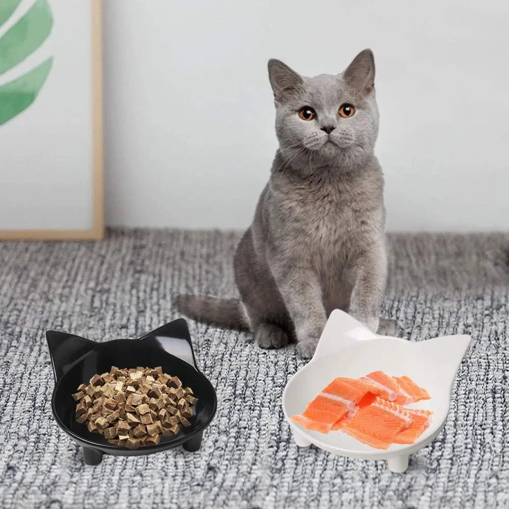 Set of four shallow melamine cat bowls with non-slip rubber bases in black and white