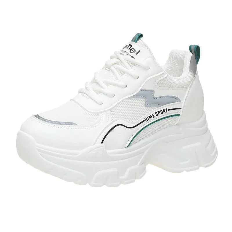 White women's dad shoes with cross shoulder straps and a round toe, shown on a foot.