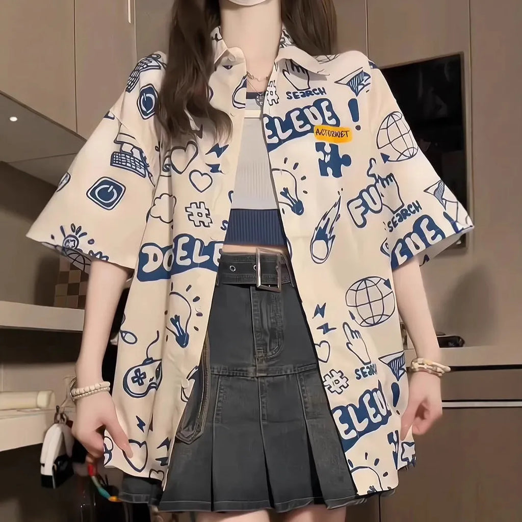 Student loose fit casual shirt with cartoon animation video game graffiti print in white or dark blue, sizes S to 2XL.