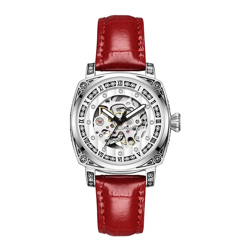 Leather strap mechanical wristwatch with luminous hands on a black dial.