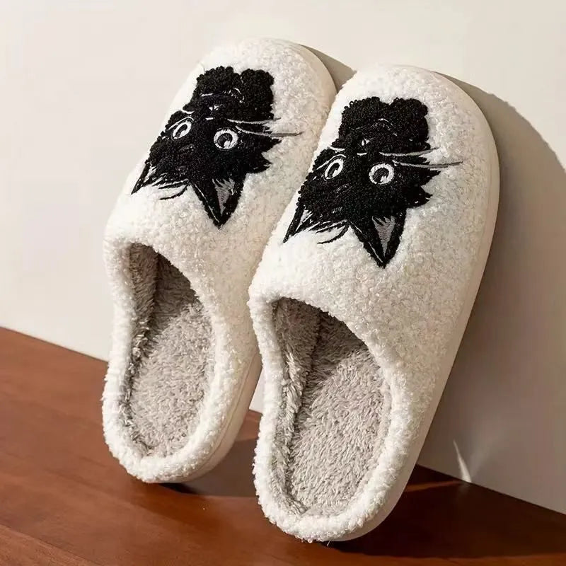 White plush slippers with Black Beard Cat cartoon couple pattern, velvet lining, and a textured non-slip sole.