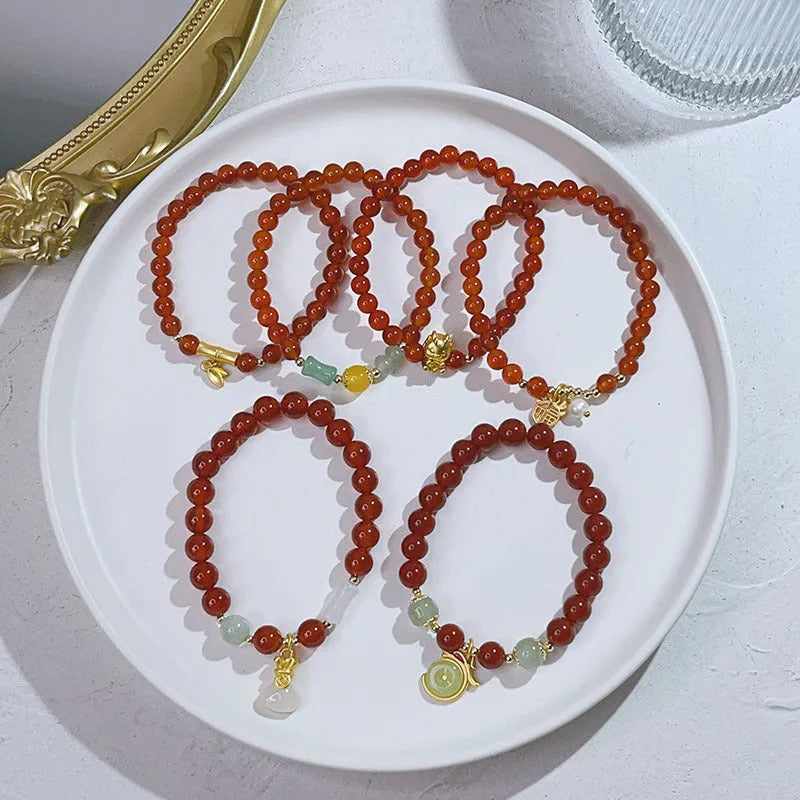 Handmade red agate bracelet with dragon motif for women, Chinese style.