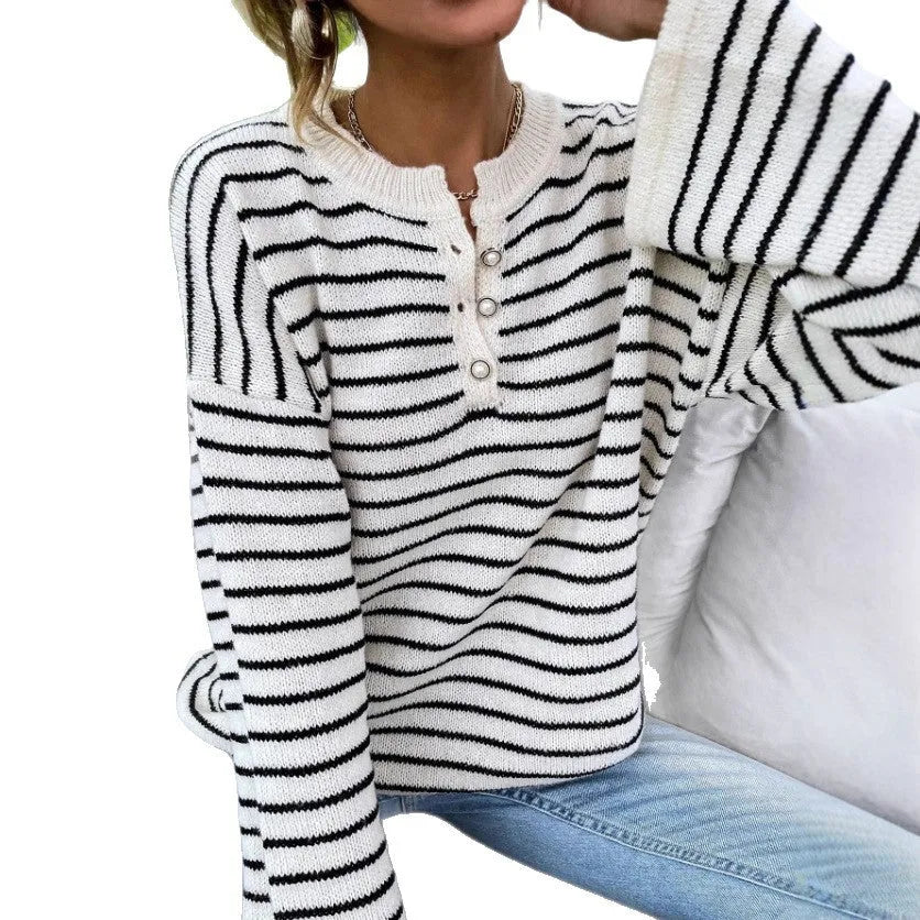 Black striped women's casual top with drop-shoulder sleeves and button detail
