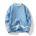 Man wearing a loose-fit, light blue, long sleeve two-piece acrylic sweater set