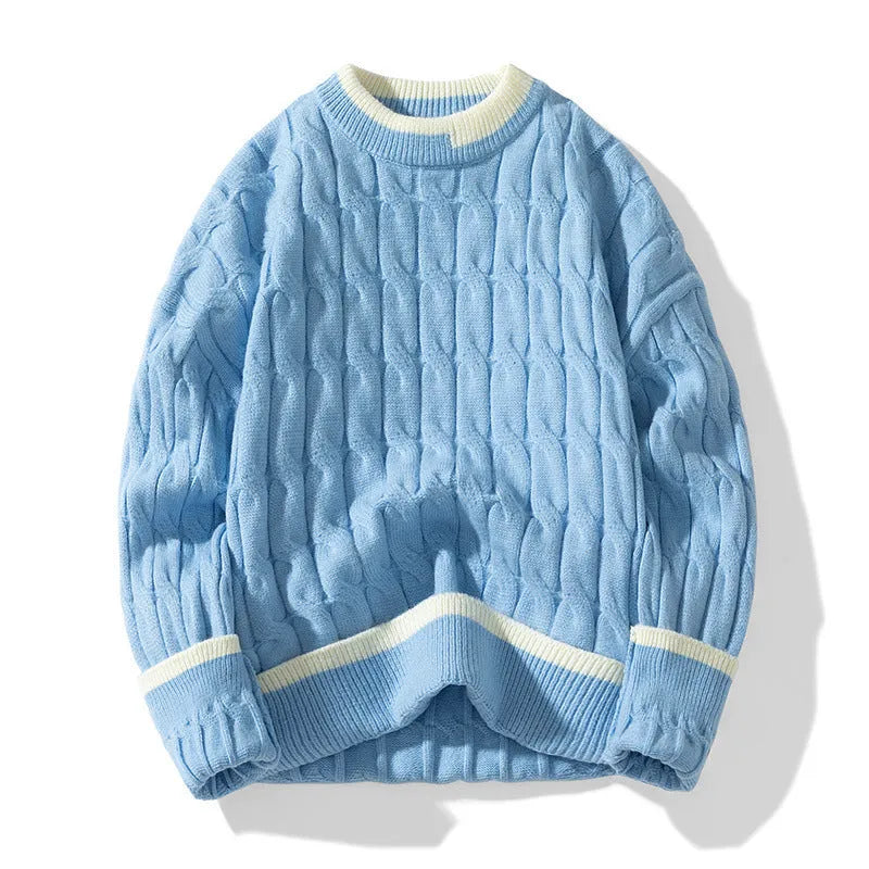 Man wearing a loose-fit, light blue, long sleeve two-piece acrylic sweater set