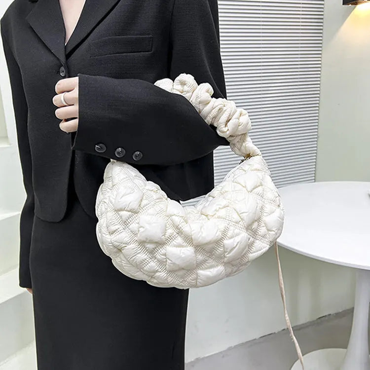 Women's solid colour nylon messenger bag with adjustable shoulder strap.
