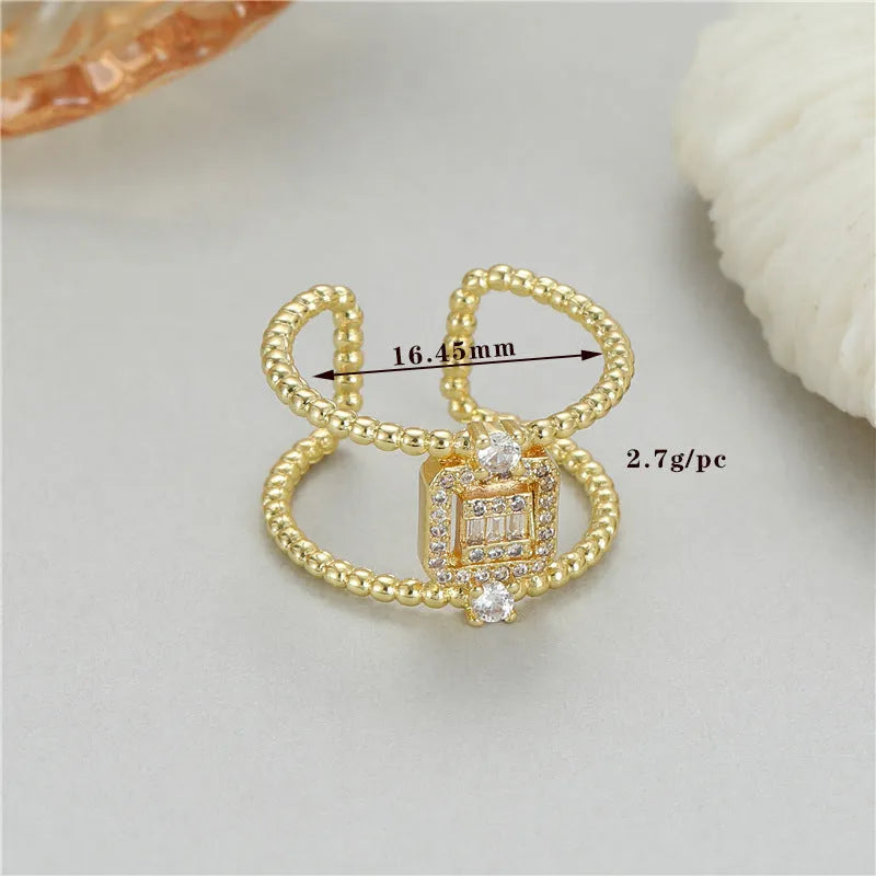 U-shaped open ring with adjustable opening in 14K gold plating over copper, asymmetric design