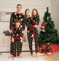 Family matching Christmas pyjamas set in red plaid print for adults, children, baby and dog