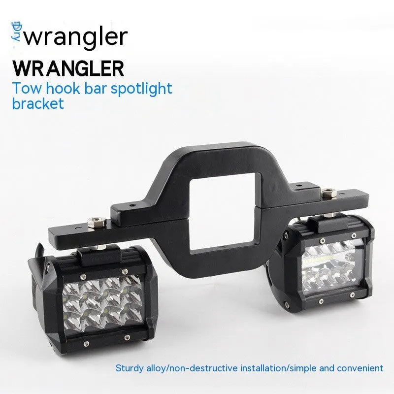 Black aluminium alloy LED reverse light mounting bracket for Jeep Wrangler off-road vehicle.