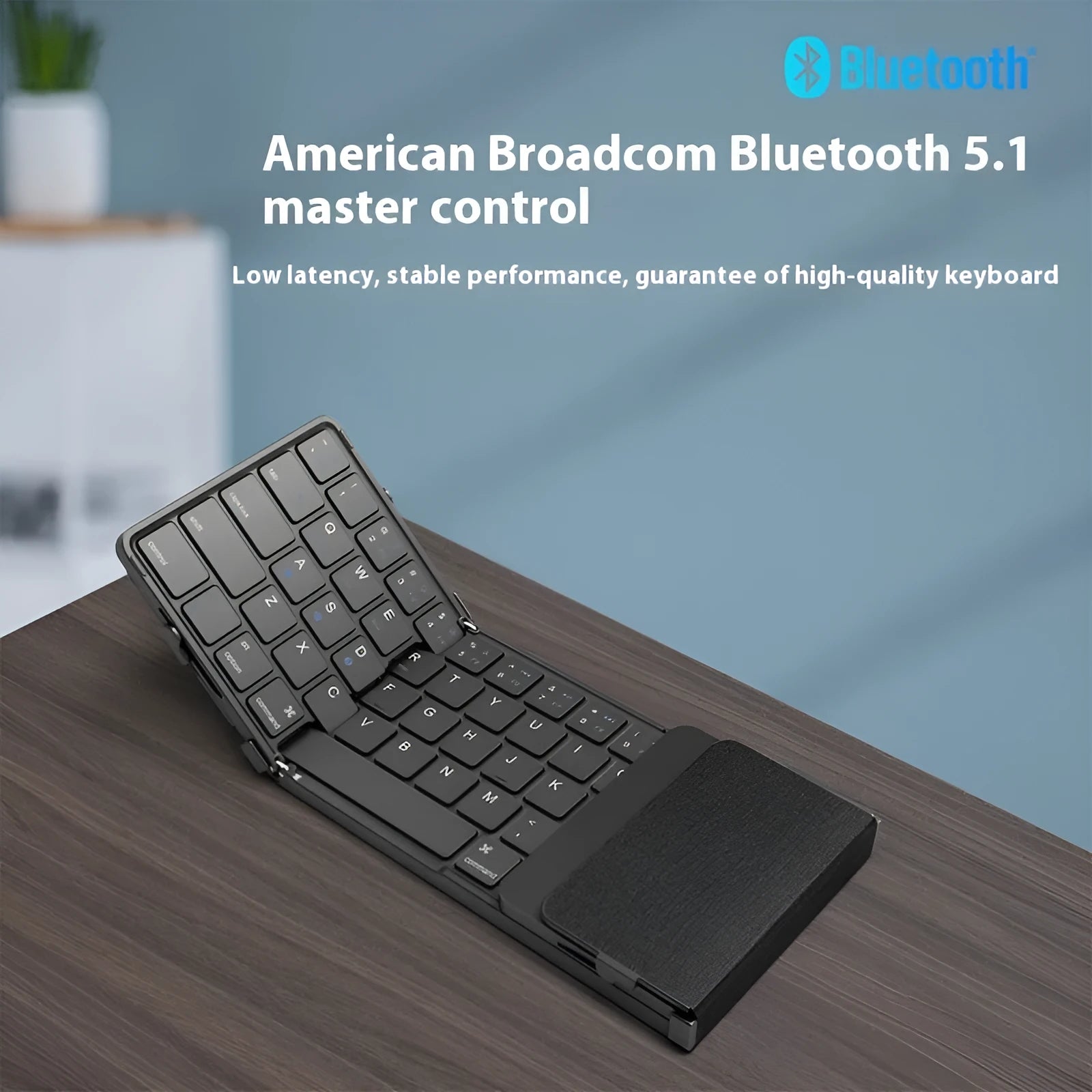 Black foldable Bluetooth keyboard for mobile devices with mute keys
