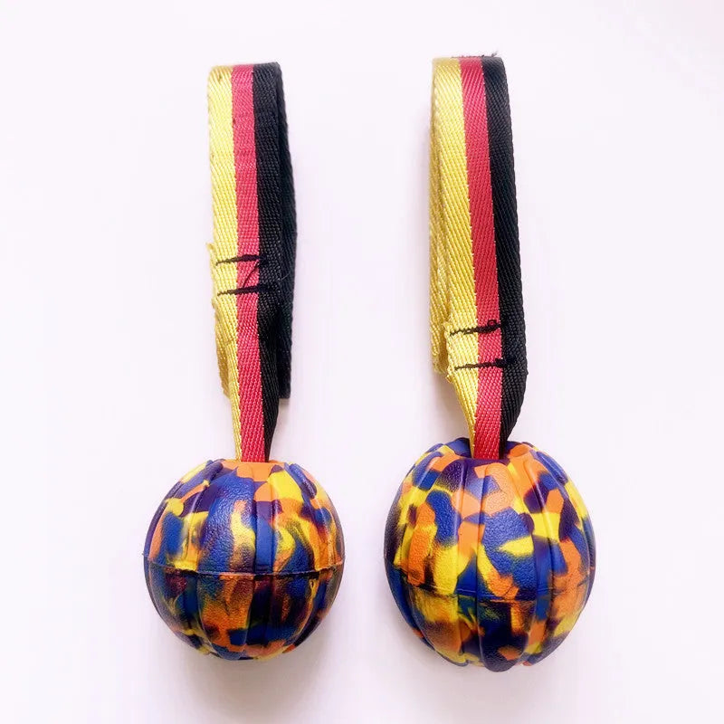 Floating EVA pet training ball with attached string in camouflage or yellow colour
