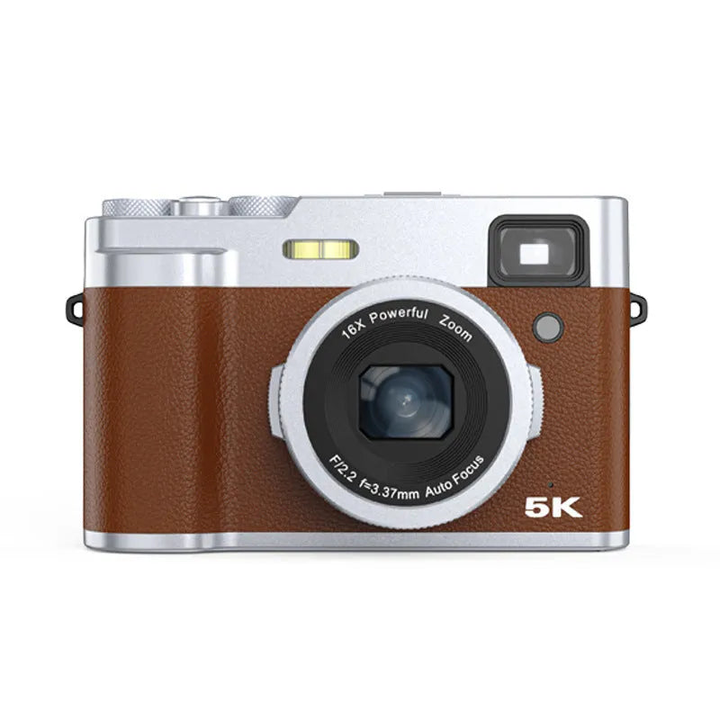 Black 5K HD digital camera with front and rear lenses, 2.88-inch screen, and optical viewfinder on a table with accessories.