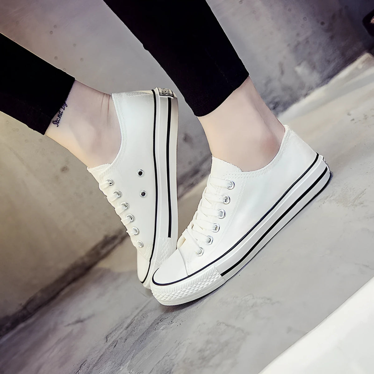 Women's solid colour canvas shoes in black, white and red colourways with casual design