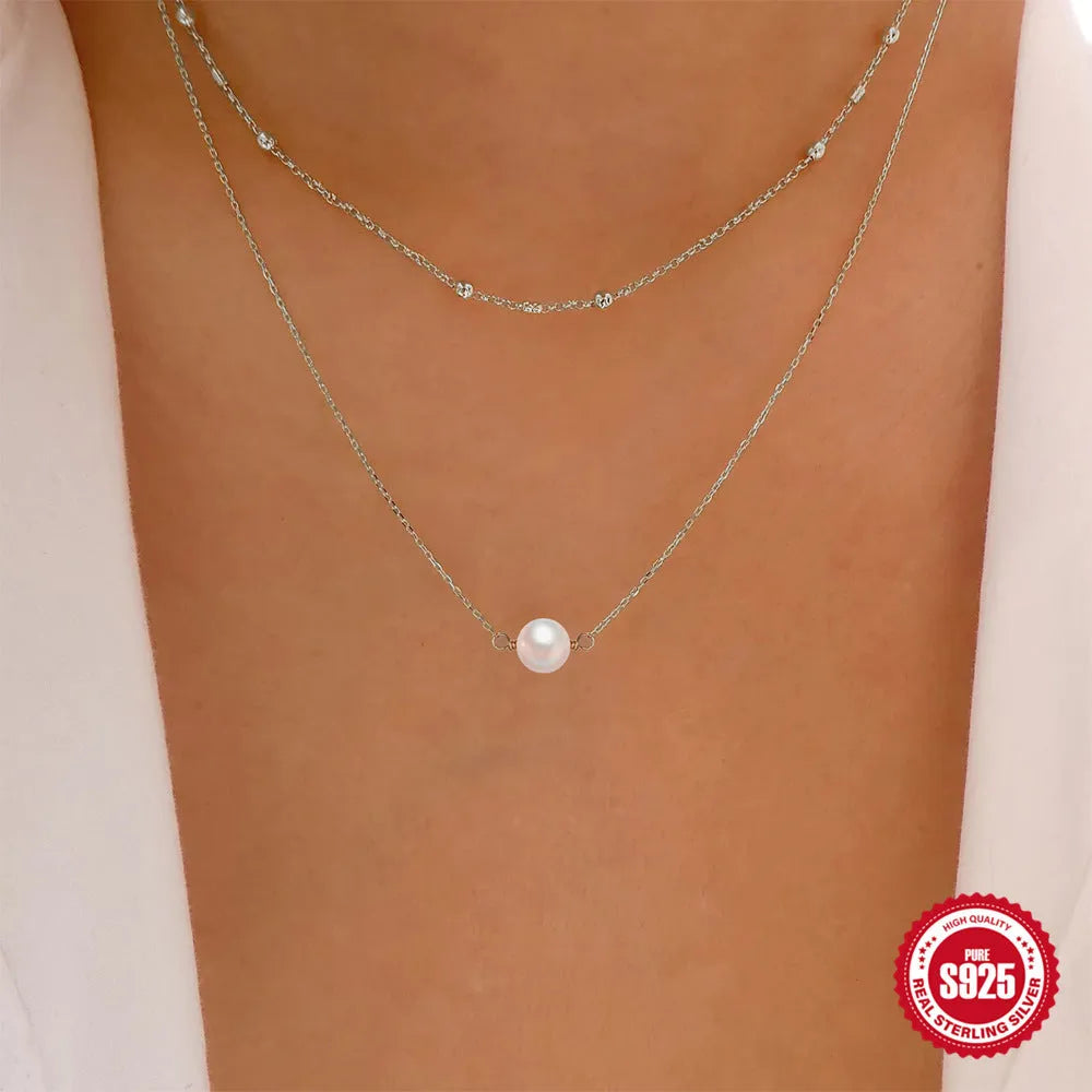 S925 sterling silver double layer necklace with twin pearl accents in gold colour